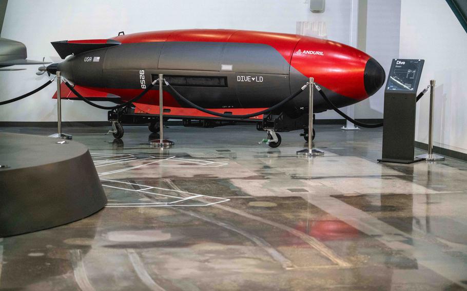 A red and black vessel that looks like a miniature submarine.