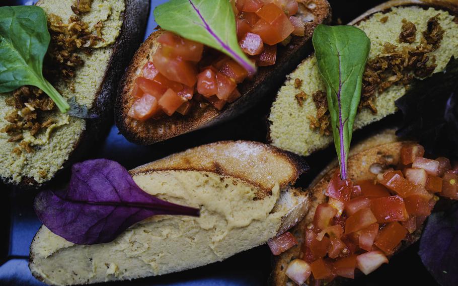 A colorful array of the bruschetta appetizer at Grifo Restaurant in Kerzenheim, Germany, features a unique twist with garbanzo bean and basil pesto.