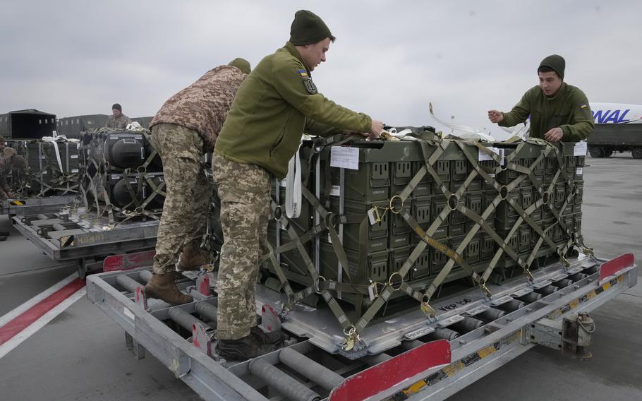 Ukrainian servicemen unpack shipment of military aid Friday, Feb. 11, 2022, at the Boryspil airport, outside Kyiv, Ukraine. The shipment was part of the U.S. security assistance to Ukraine. Lawmakers on Tuesday, March 1, 2022, called for the immediate passage of another multibillion-dollar emergency spending package to aid Ukraine as Russian forces closed in on the country’s capital city of Kyiv.