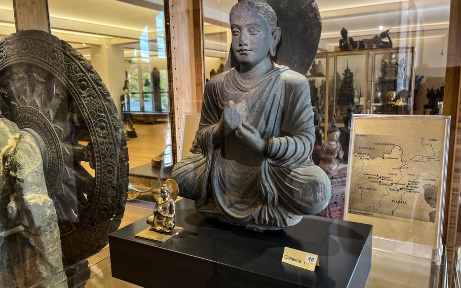 A Buddha sculpture from Gandhara, today's border region between Pakistan and Afghanistan, on display at the Buddha Museum in Traben-Trarbach, Germany, June 11, 2022. The Gandhara sculptures are considered some of the oldest depictions of the Buddha in human form and show Greek and Roman influence in their design.