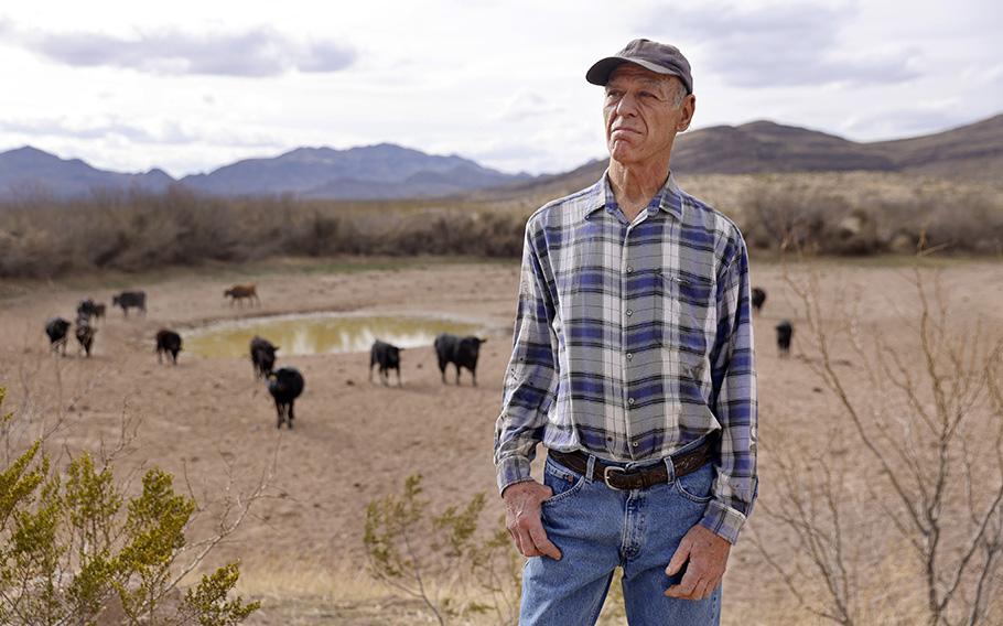 Bill Addington stands before a stock pond on March 20, 2023, south of Sierra Blanca, Texas, at the scene where a migrant was killed. The accused shooters, 60-year-old brothers Michael and Mark Sheppard, who both worked in local law enforcement, thought they were firing on wild hogs.