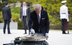 U.S. President Joe Biden participates in a wreath laying ceremony at Seoul National Cemetery, Saturday, May 21, 2022, in Seoul.