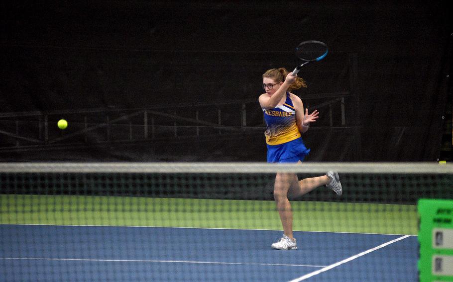 Wiesbaden's Bella Rainey hits the ball as she and fellow Warrior Samaire Fleming square off against Lakenheath's Elisabeth Petrich and Maddison Beedham in pool-play action of the DODEA European tennis championships on Oct. 19, 2023, at T2 Sports Health Club in Wiesbaden, Germany.