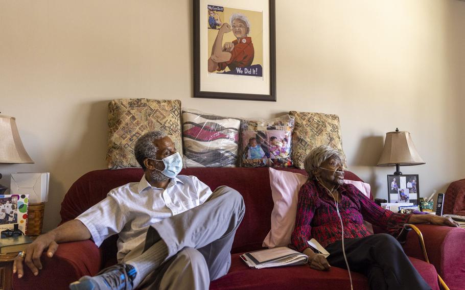 Documentary producer Gregory Cooke sits with Ruth Wilson at Wilson's Philadelphia home. Cooke interviewed Wilson for his film "Invisible Warriors."