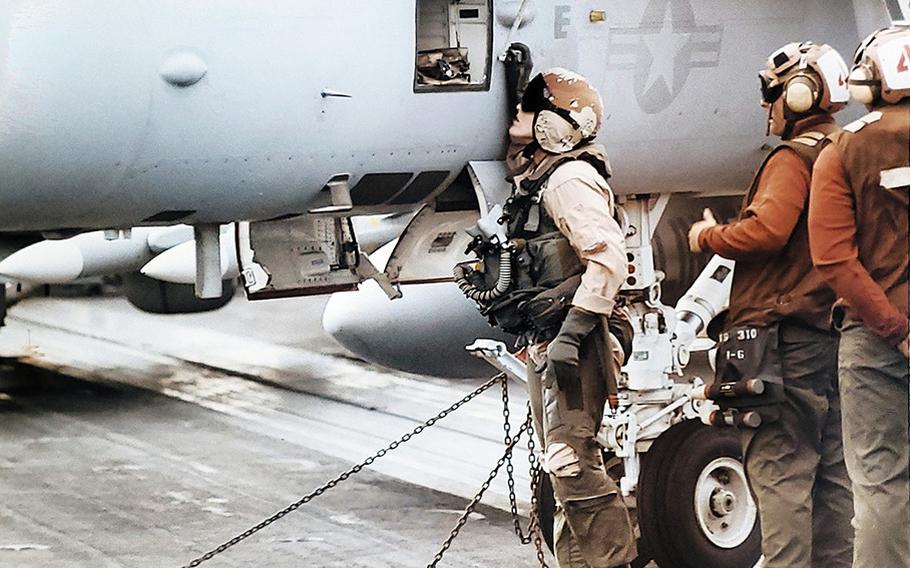 Joy Dean conducts a preflight inspection of her F/A-18C prior to launching on her first strike mission in support of Operation Southern Watch over Iraq.