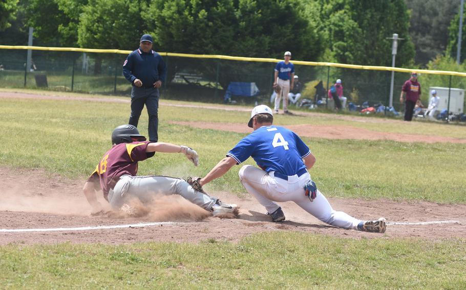 Vilseck's Parker Wayland is safe at third before Ramstein's Caden Nims can apply the tag Thursday, May 22, 2025, at the DODEA-Europe Division I baseball championships at Ramstein Air Base, Germany.