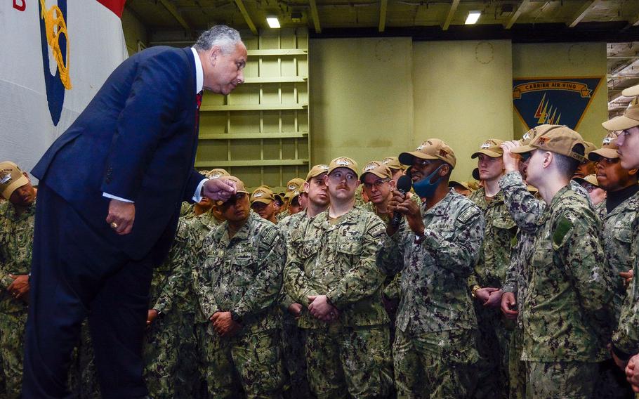 Secretary of the Navy Carlos Del Toro takes questions from sailors aboard the aircraft carrier USS Ronald Reagan at Yokosuka Naval Base, Japan, Tuesday, Oct. 26, 2021.