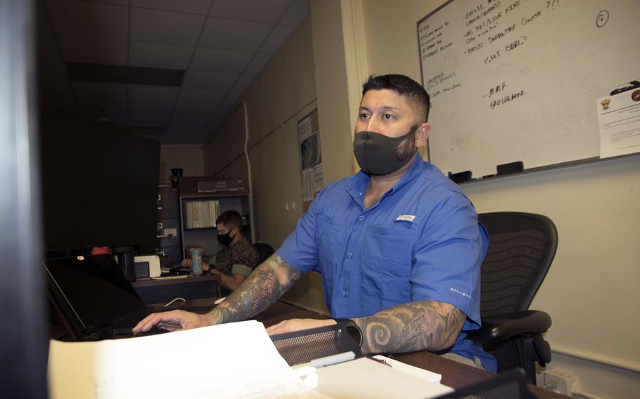 Marine Corps contractor Joe Ornauer works at his office on Camp Kinser, Okinawa, Wednesday, Sept. 1, 2021. He serves as an instructor for 3rd Marine Logistics Group’s indoor marksmanship simulator.