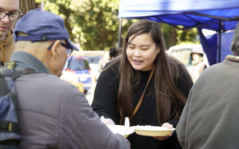 Air Force spouse Lorraine Cook-Ransdell serves meals to homeless people at Tokyo’s Ueno Park, March 15, 2024.