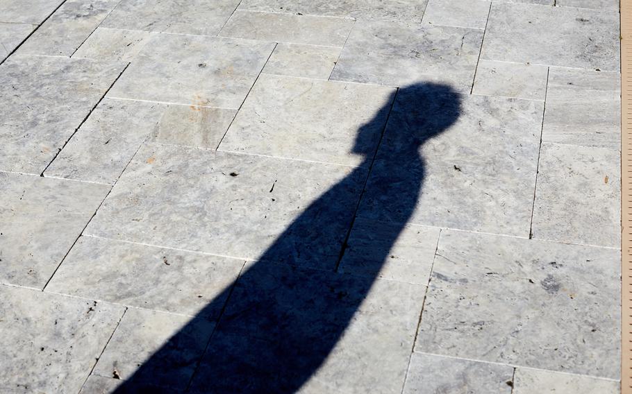 The shadow of Rafael Jenkins, who was threatened with a lynching by a White student during Hell week in 2018. 