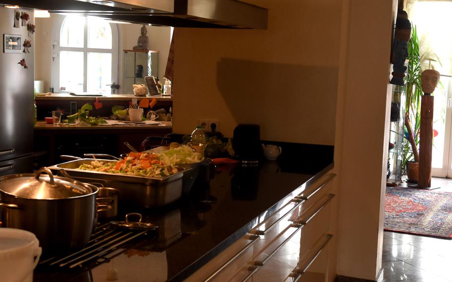 The kitchen is in an open area inside Thai Corner in Gruenstadt, Germany, allowing diners to see the chef at work.