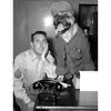 Hanau, Germany, August 3, 1955: Mrs. Olga Ruhlow, wife of Sgt. Wilbur Ruhlow, called Stars and Stripes to say that she thought the family dog — a 5½-year-old boxer named Bruno — bore a striking resemblance to a tough first sergeant when dressed in Army togs, and would make a good subject for a photo. Here's Bruno with Sgt. Ruhlow.

Did you know May is National Pet Month? Or that German dogs say wuf wuf, instead of woof woof?

Stars and Stripes' photo archives feature many a pet, just as one can see in this image from 1955. Be it military barracks in Germany, Korea, Vietnam or Afghanistan, servicemembers and their families love their pets! 

Looking for more of Stars and Stripes' furtastic coverage? Subscribe to Stars and Stripes’ historic newspaper archive! We have digitized our 1948-1999 European and Pacific editions, as well as several of our WWII editions and made them available online through https://starsandstripes.newspaperarchive.com/

META TAGS: Europe; West Germany; National Pet Month; dog; canine; boxer; animal; U.S. Army