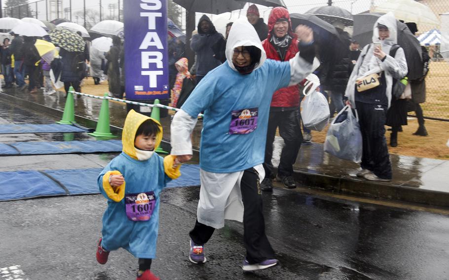 Rain didn't stop families from taking part in the 2K event during the 43rd annual Yokota Striders Frostbite Road Race at Yokota Air Base, Japan, Sunday, Jan. 21, 2024.