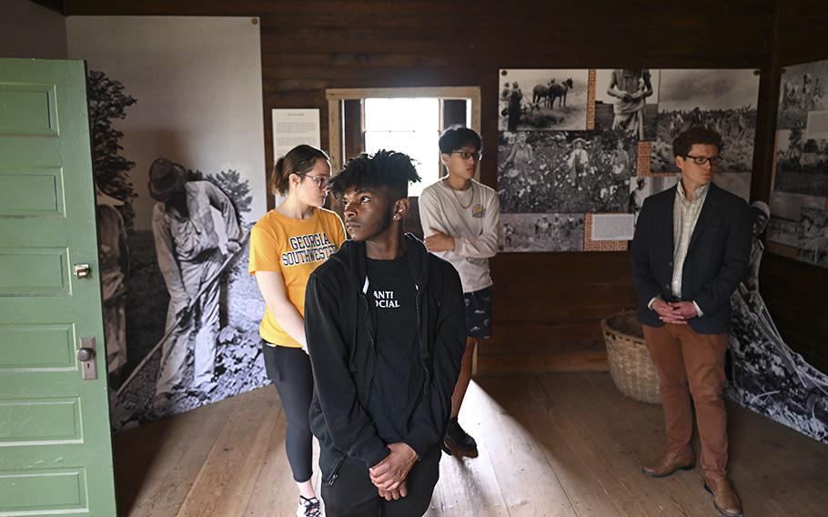 Georgia Southwestern State University students join their professor on a tour of a home at the Jimmy Carter Boyhood Farm. M