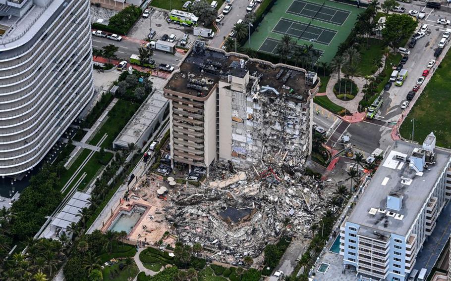 This aerial view shows search and rescue personnel working on site after the partial collapse of the Champlain Towers South in Surfside, north of Miami Beach, on June 24, 2021.