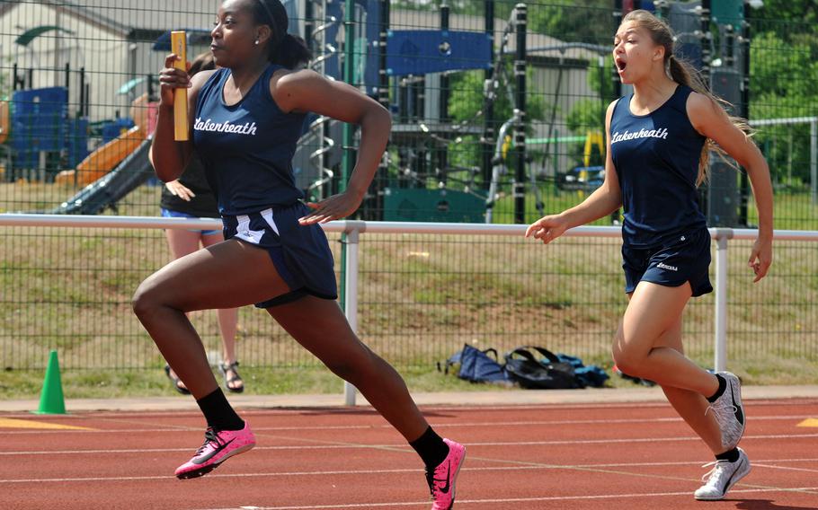 Lakenheath’s Ciara Butcher takes off after getting the baton from teammate Sonja Dexter in the girls 4x100-meter relay race at the DODEA-Europe track and field championships in Kaiserslautern, Germany. The pair, along with Shovonda Jones and Makayla Whitfield, won the race in 51.47 seconds.