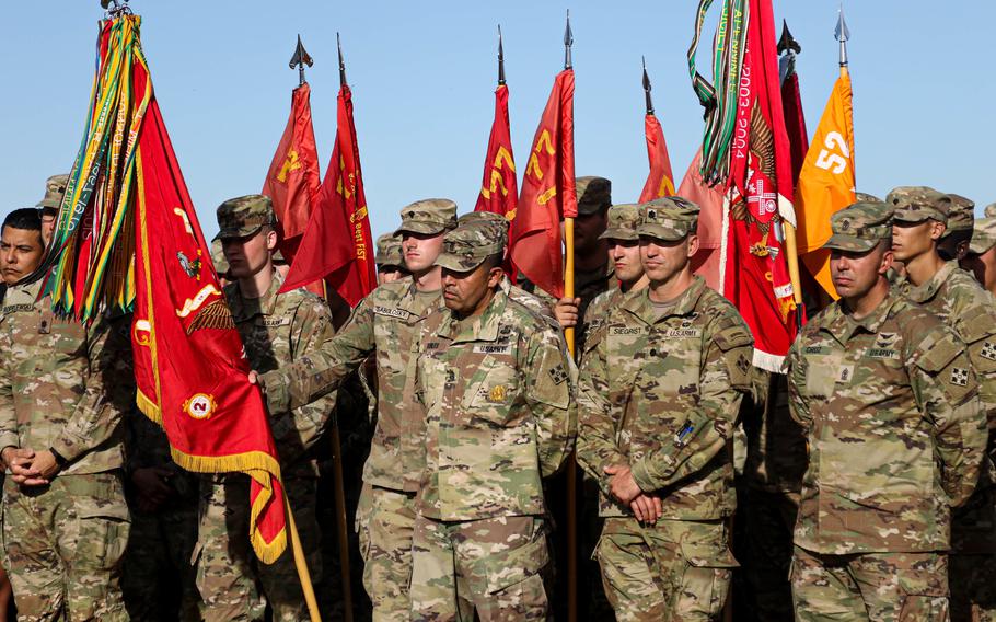 Soldiers assigned to 2nd Battalion, 77th Field Artillery Regiment and 52nd Brigade Engineer Battalion, 2nd Stryker Brigade Combat Team, 4th Infantry Division, stand in a brigade formation on Oct. 7 at a brigade formation at Fort Carson, Colo. 