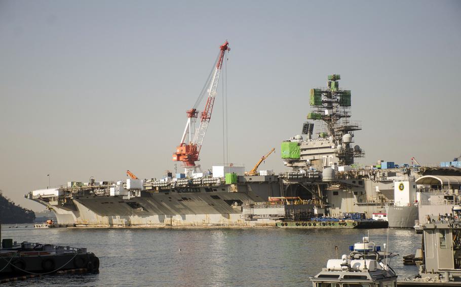 The aircraft carrier USS Ronald Reagan undergoes maintenance at Yokosuka Naval Base, Japan, Feb. 17, 2023.