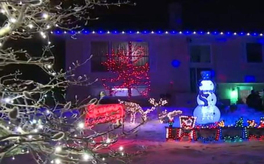 A video screen grab shows lighted Christmas decorations that were set up in front of Vietnam veteran Tom McMahon’s Eau Claire, Wis., home.