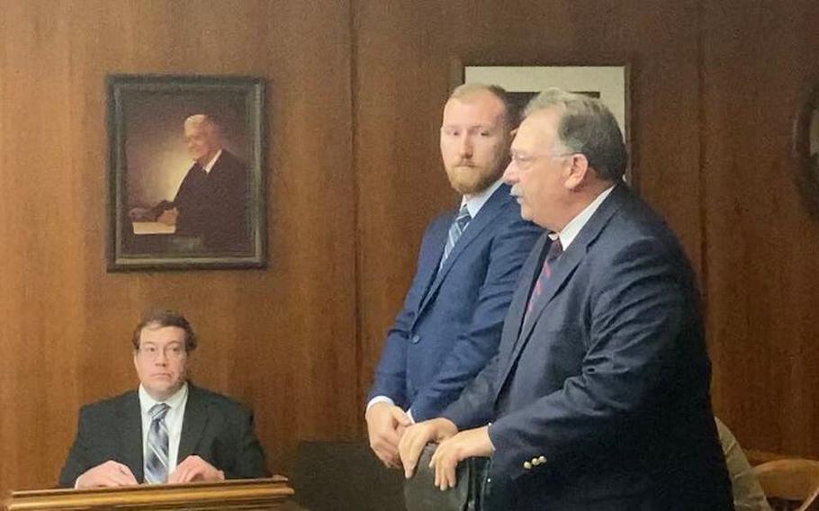 Cameron H. Zuzula (middle) appears in Saginaw County Circuit Court on Oct. 2, 2023, beside attorney Russell J. Perry Jr.