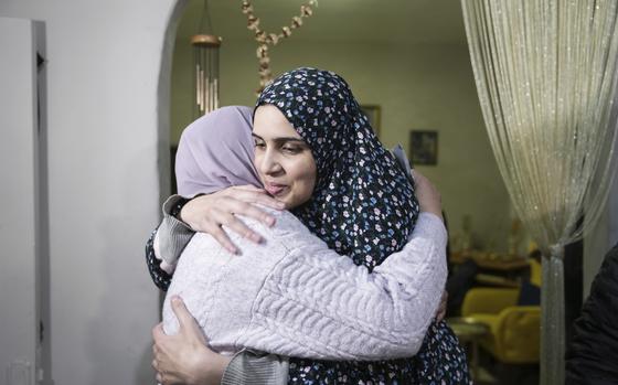 Marah Bakir, right, a former Palestinian prisoner who was released by the Israeli authorities, is welcome at her family house in the east Jerusalem neighborhood of Beit Hanina, Friday, Nov. 24, 2023. The release came on the first day of a four-day cease-fire deal between Israel and Hamas during which the Gaza militants have pledged to release 50 hostages in exchange for 150 Palestinians imprisoned by Israel. (AP Photo/Mahmoud Illean)