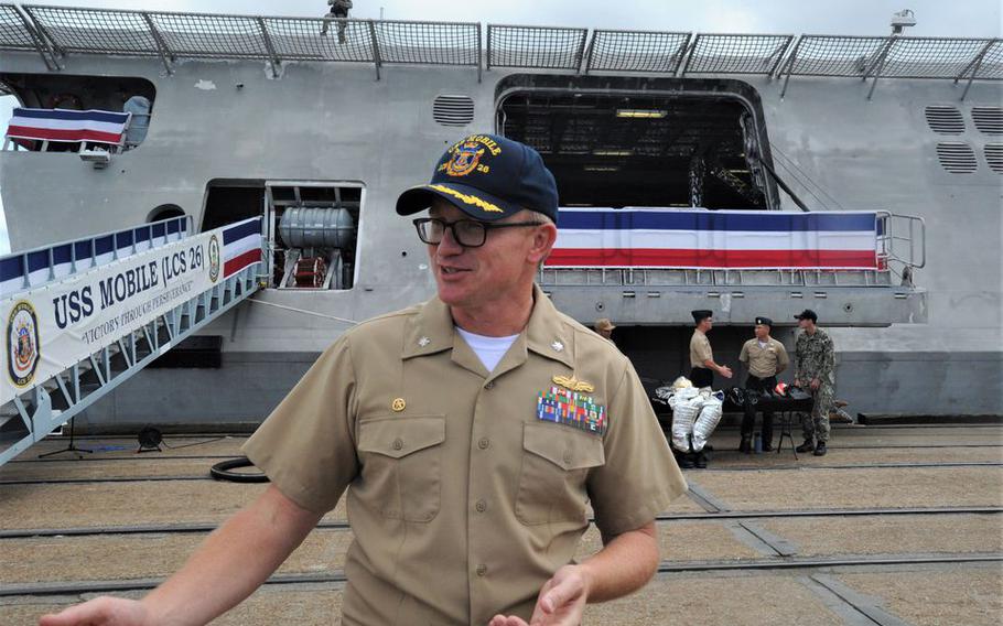 Cmdr. Christopher W. Wolff, commanding officer of LCS-26, speaks on May 20 ahead of commissioning ceremonies for the Littoral Combat Ship named for the city of Mobile.