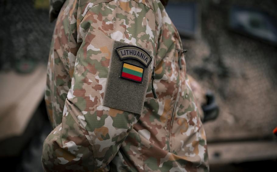 A Lithuanian soldier where a country patch on his uniform sleeve.