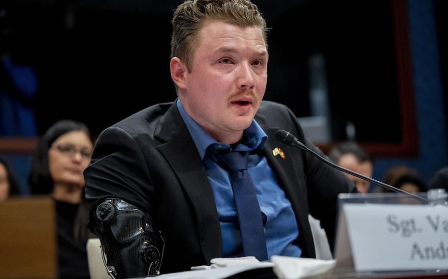 Marine veteran Sgt. Tyler Vargas-Andrews, who was gravely injured, losing an arm and a leg in a suicide attack at Hamid Karzai International Airport in Kabul, becomes emotional as he recounts his story during a House Committee on Foreign Affairs hearing on the United States evacuation from Afghanistan on Capitol Hill in Washington, Wednesday, March 8, 2023.