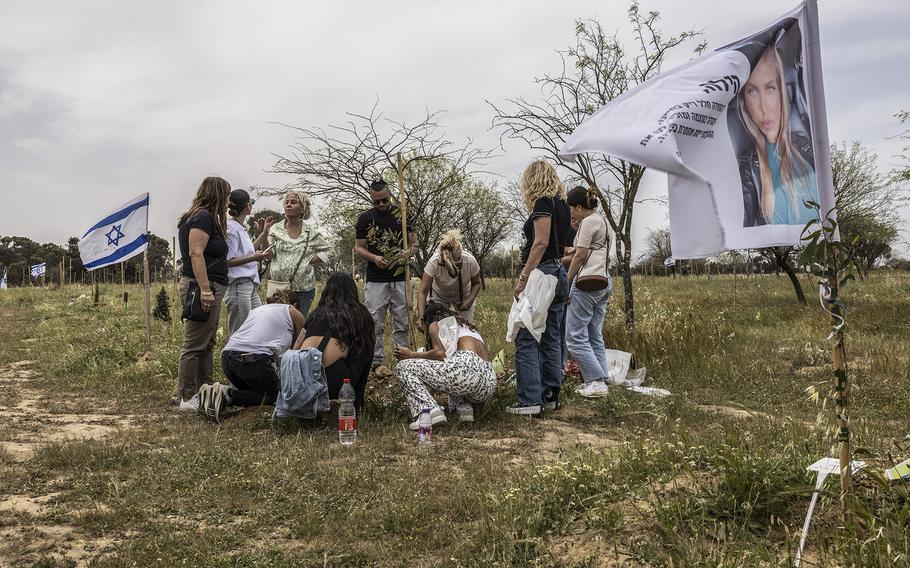 Members of the Naftali family visit the memorial to Eden Naftali, a festivalgoer murdered on Oct. 7, 2023.