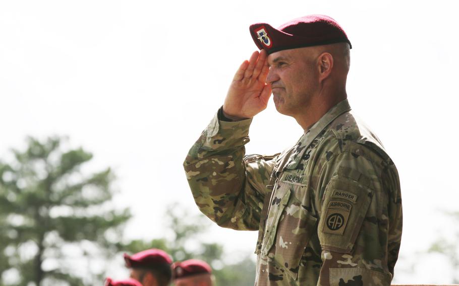 Then-Maj. Gen. James Mingus salutes marching paratroopers during a change-of-command ceremony in August 2018 at Pike Field on then-Fort Bragg, N.C., which is now Fort Liberty. 