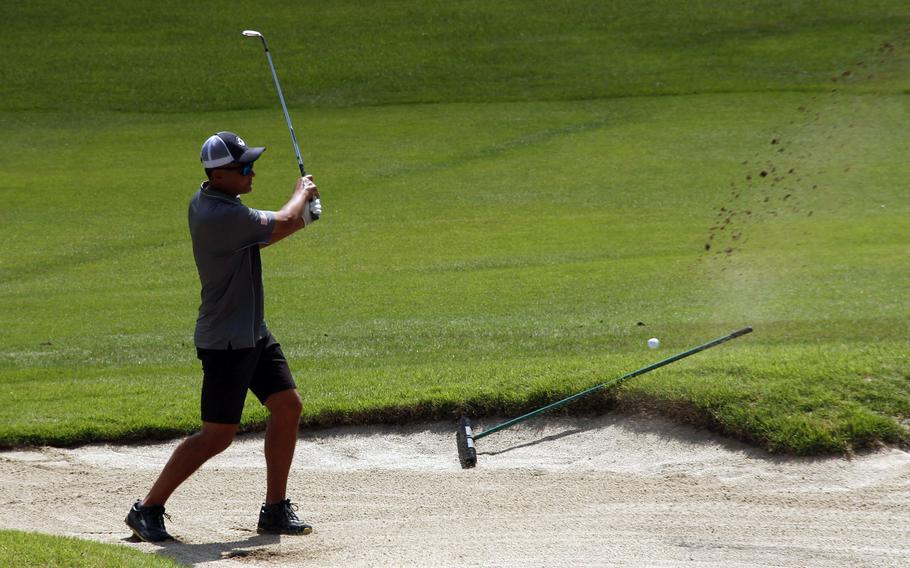 Steve Nakashima of Okinawa's Taiyo Golf Club blasts out of a bunker during Sunday's second round in the All-Japan Interservice Golf Tournament at Tama Hills Golf Club in Tokyo's western suburbs. Nakashima finished 13th in the Captain's Flight.