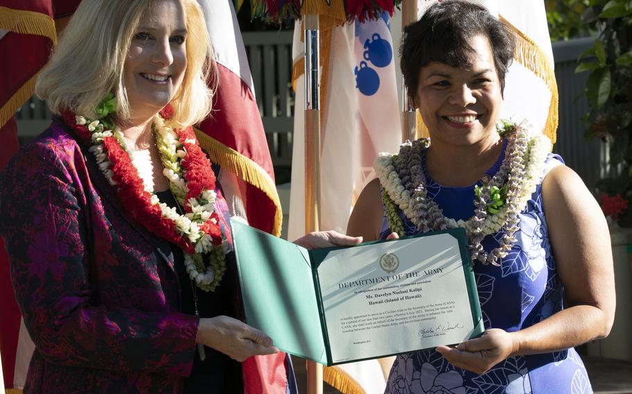 U.S. Secretary of the Army Christine Wormuth presents newly appointed Civilian Aide to the Secretary of the Army (CASA), Mrs. Noelani Kalipi of the island of Hawaii, the oath of office certificate on Fort Shafter, Hawaii, Aug. 9, 2021. CASAs are business and community leaders appointed by the Secretary of the Army to advise and support Army leaders across the country.