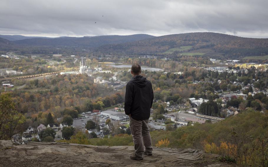 Korey Rowe stands at the overlook at the top of the trail he used to frequent as a young man in Oneonta, N.Y., on October 19, 2021.