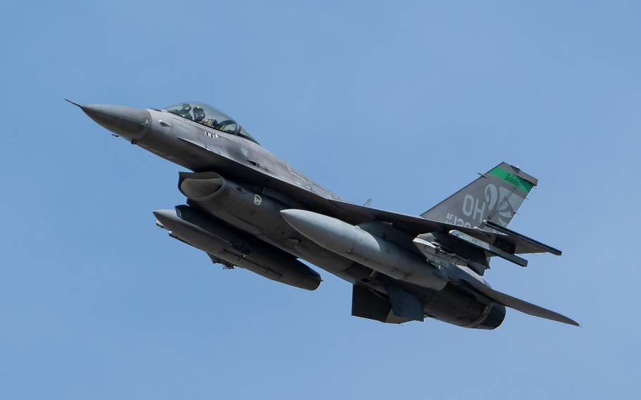 An F-16 Fighting Falcon from the Ohio Air National Guard’s 180th Fighter Wing in Toledo, Ohio, steaks over the Clark Memorial Bridge to kick off the Thunder Over Louisville air show in Louisville, Ky., Saturday, April 20, 2024.