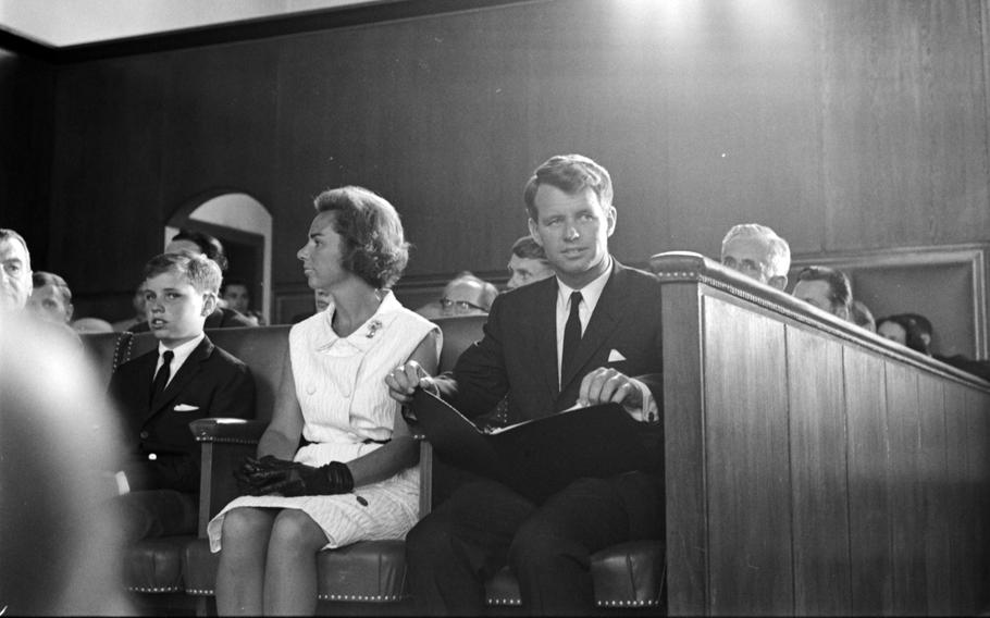 RFK seated with light coming in from above him.