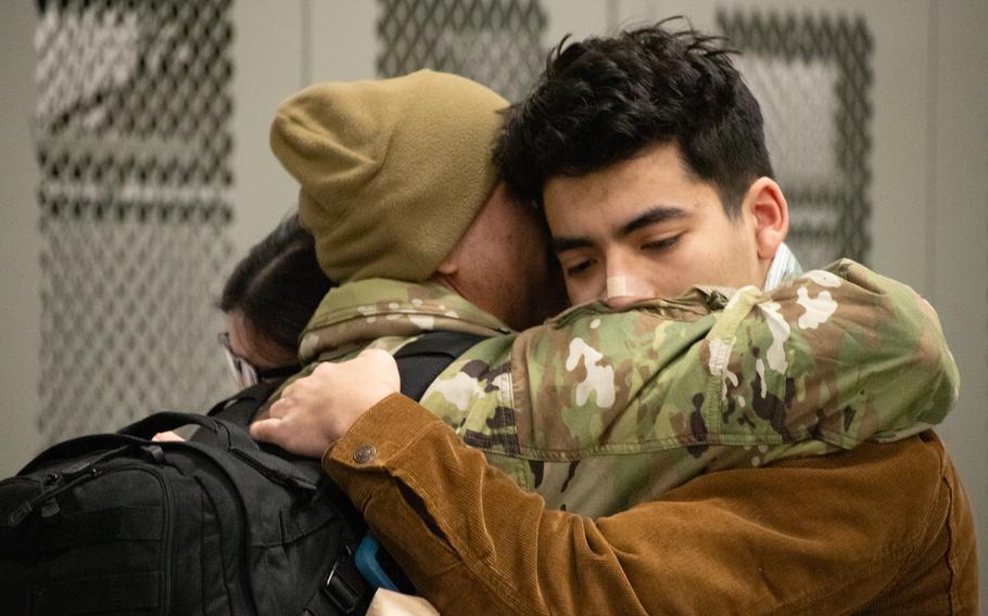 Family members welcome home soldiers from the 98th Support Maintenance Company (SMC), 17th Combat Sustainment Support Battalion, 11th Airborne Division, who returned to Joint Base Elmendorf-Richardson, Alaska, Thursday, March 28, 2024, after a nine-month deployment to Europe. 