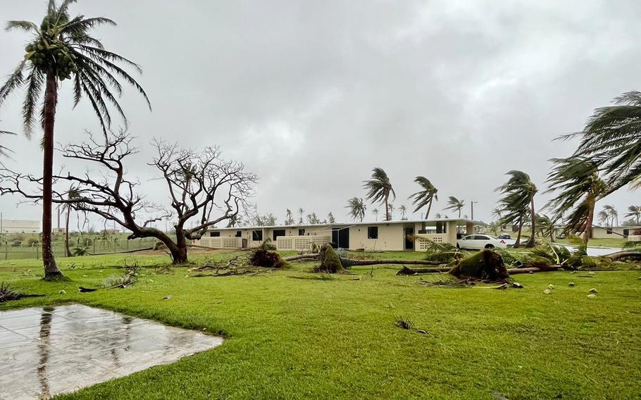 Fallen trees and debris litter a residential area at Andersen Air Force Base, Guam, Thursday, May 25, 2023, as Typhoon Mawar moves away from the island. 