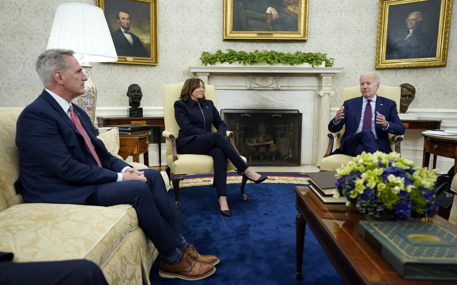 Speaker of the House Kevin McCarthy, left, Vice President Kamala Harris and President Joe Biden meet in the Oval Office of the White House, Tuesday, May 16, 2023, in Washington. 