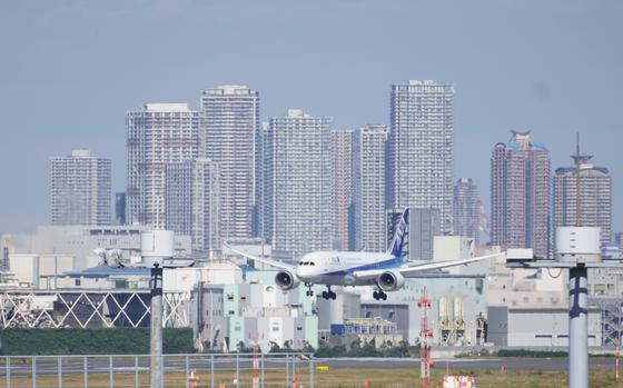 An international flight lands in November at Haneda International Airport in Tokyo.