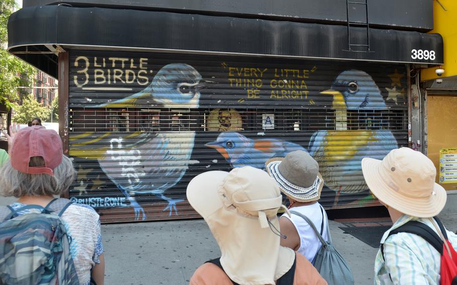 Painted by artist BlusterOne, this mural at 3898 Broadway in Manhattan, seen on June 26, 2022, was inspired by the Bob Marley song “Three Little Birds.” 