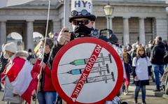 FILE - A man takes part in a demonstration against the country's coronavirus restrictions in Vienna, Austria, Nov. 20, 2021. Austria's parliament is due to vote Thursday, Jan. 20, 2022, on plans to introduce a COVID-19 vaccine mandate for the adult population, the first of its kind in Europe. (AP Photo/Lisa Leutner, File)