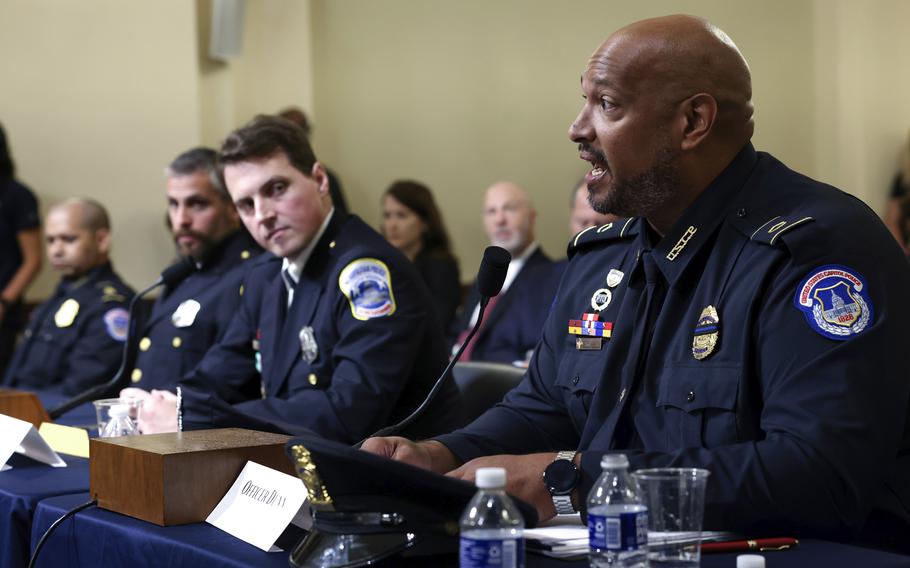 Washington Metropolitan Police Department officer Daniel Hodges, second from right, listens as U.S. Capitol Police Sgt. Harry Dunn testifies during the House select committee hearing on the Jan. 6 attack on Capitol Hill in Washington, Tuesday, July 27, 2021. U.S. Capitol Police Sgt. Aquilino Gonell, left, and Washington Metropolitan Police Department officer Michael Fanone, second from left, listen. 