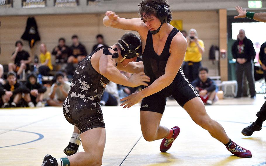 Vilseck's Garrett Hyten avoids a takedown move by Stuttgart's Jack Gruver in a 190-pound match at the DODEA sectional wrestling tournament on Feb. 3, 2024, at Stuttgart High School in Boeblingen, Germany.