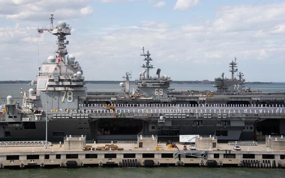 The USS Gerald R. Ford beside the USS Dwight D. Eisenhower and the USS George H. W. Bush at Naval Base Norfolk. The Navy's 2025 budget will fund work on two new Ford-class carriers, one of which is slated to replace the Eisenhower by 2027.