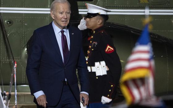 FILE - President Joe Biden arrives at Delaware Air National Guard Base in New Castle, Del., Friday, Nov. 17, 2023. Biden is visiting naval installations in Virginia on Sunday to kick off the holiday week by hosting a screening of the movie “Wonka” and having a “friendsgiving” meal with service members and their relatives.  (AP Photo/Manuel Balce Ceneta, File)