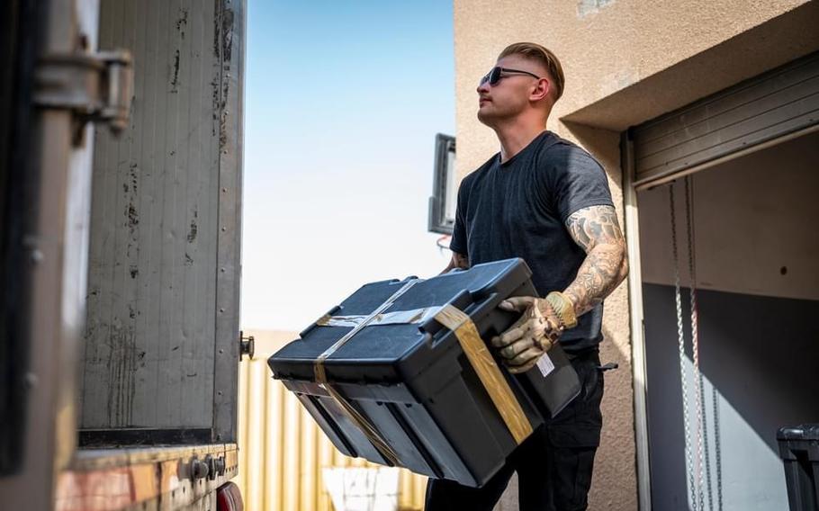 Senior Airman Travis Spong loads a truck preparing to dispatch mail to the airport at Al Udeid Air Base, Qatar, in this undated photo.