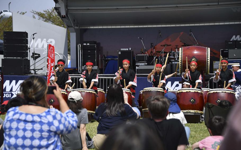 Taiko drummers in front of a crowd.
