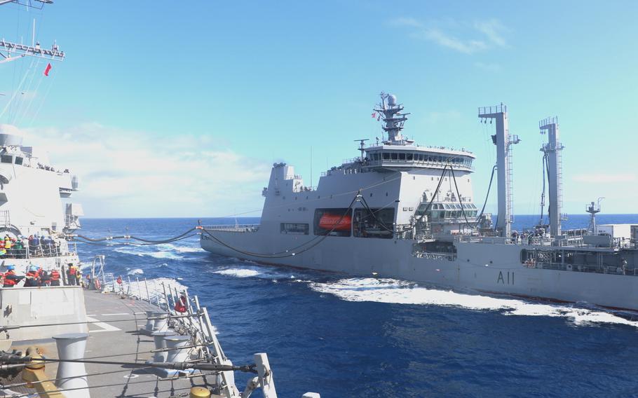 The guided-missile destroyer USS Howard, left, is replenished by the New Zealand oiler HMNZS Aotearoa on Nov. 23, 2021. 