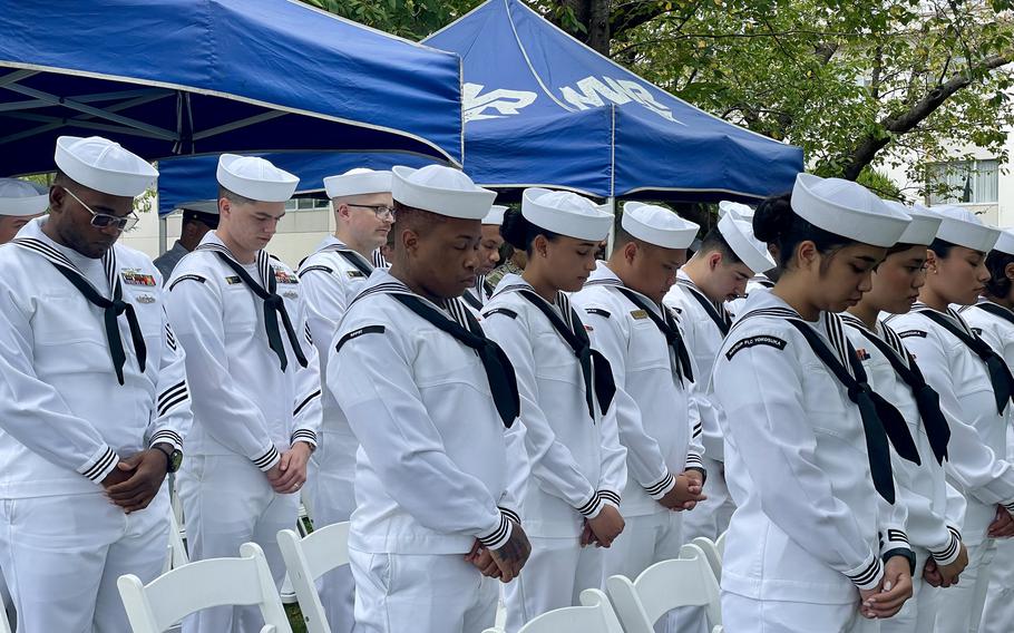 Sailors pause for prayer at the annual Navy Gold Star Program’s Bells Across America for Fallen Service Members event at the Kosano Park on Yokosuka Naval Base, Japan, on Sept. 21, 2023.