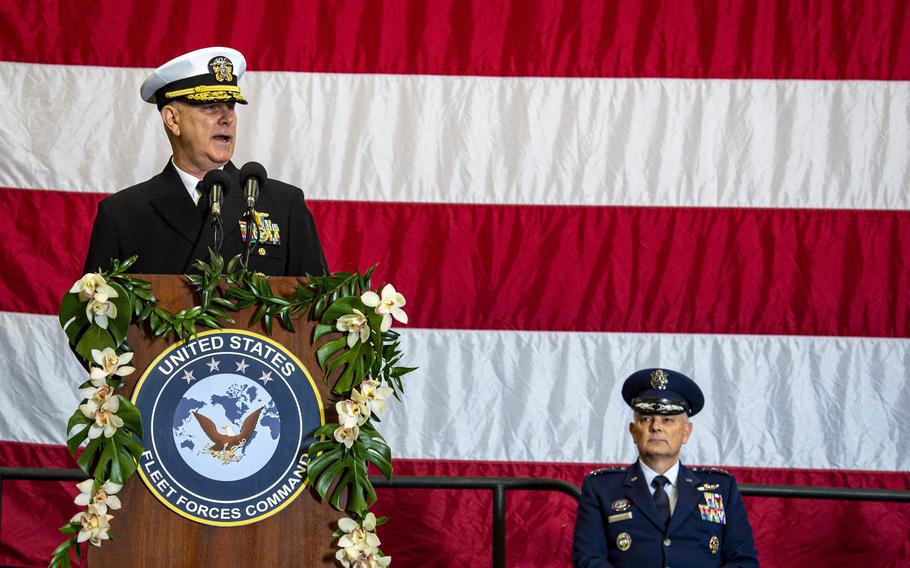 Adm. Christopher Grady, former commander of U.S. Fleet Forces Command, delivers his final remarks at Norfolk, Va., before being relieved by Adm. Daryl Caudle, not shown, during the change of command ceremony aboard USS George H. W. Bush on Dec. 7, 2021. 